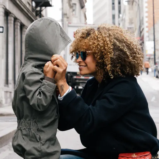 a girl holding a small child